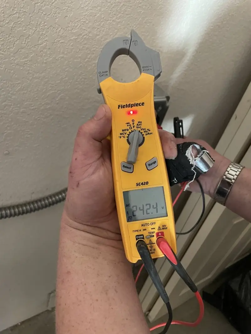 Voltage testing with clamp meter during Generator Installation in Immokalee